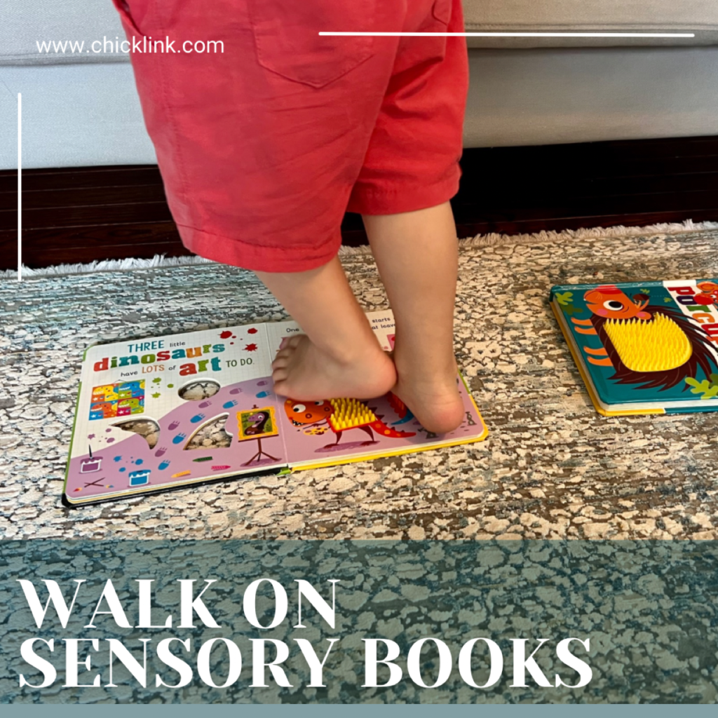 Walking on sensory books, walking on touch and feel books, sensory games, sensory activities, sensory activities for toddlers, sensory activities for one year olds, sensory activities for 2 year olds, things to do with one year olds, things to do with 1.5 year olds, things to do with 2 year olds, activities for 18 month olds, activities for 14 month olds, toddler activities, activities for 12-18 month olds, activities for 16 month olds, activities for 2 year olds, toddler games