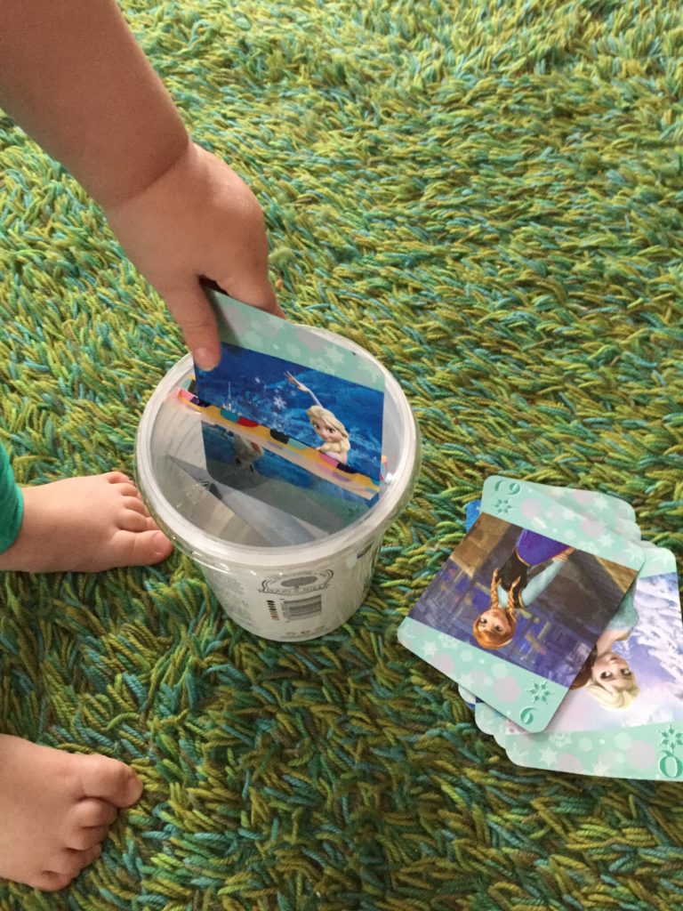 Wednesday box of activities. Inserting cards into a container. Activities for 15 month olds, activities for 16 month olds, activities for 17 month olds, activities for 18 month olds, activities for toddlers, activities for 19 month olds, activities for 20 month olds