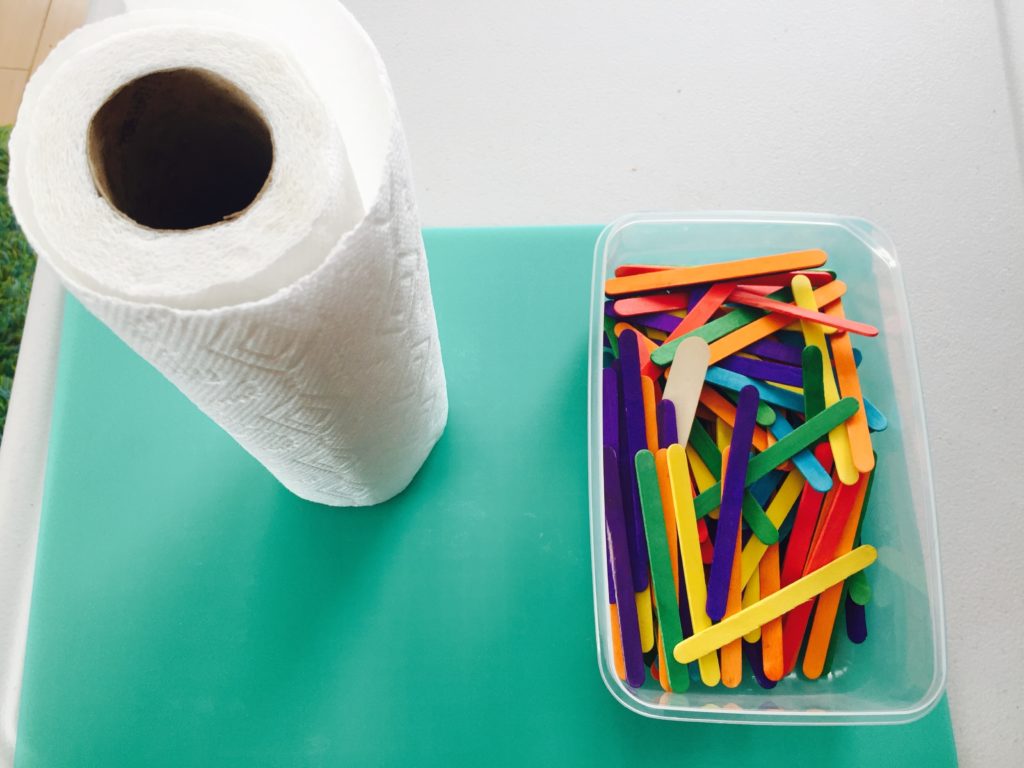 Craft Sticks Drop, Thursday box of activities for 12-18 month olds, activities for one year old, activities for toddlers, toddler games, activities for 12 month old, activities for 13 month old, activities for 14 month old, activities for 15 month old, activities for 16 month old, activities for 17 month old, activities for 18 month old