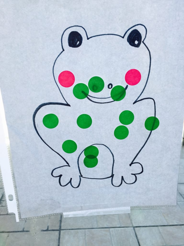 Stickers on a frog window activity, sticker toddler activity, list of activities for toddlers, activities for 18-24 month old, activities for 18 month old, activities for 19 month old, activities for 20 month old, activities for 21 month old, activities for 22 month old, activities for 23 month old, activities for 24 month old, activities for two year old, activities for three year old, learning activities for toddlers